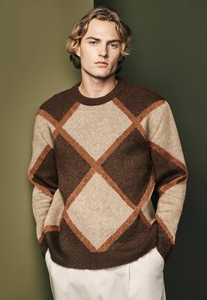 Brown and beige patterned sweater featuring a diamond design; made of textured knit material with a crew neck and ribbed hem.