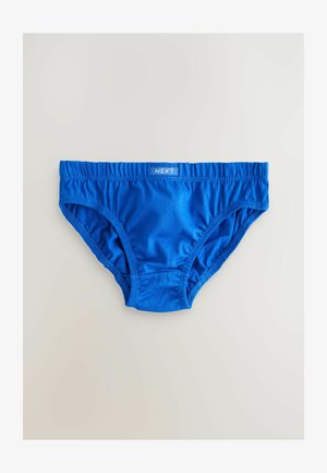 Slip en coton bleu avec ceinture élastique, présentant des coutures froncées sur les côtés et une petite étiquette portant l'inscription "NEXT."