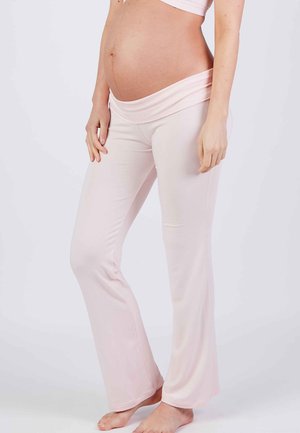 Lichtroze zwangerschapsbroek met een brede, opvouwbare tailleband. Zacht, rekbaar materiaal ontworpen voor comfort, uitlopend aan de onderkant.