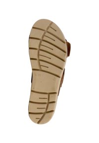 Sandale marron avec une semelle en caoutchouc texturé de couleur claire, dotée d'un motif de semelle pour une meilleure adhérence. Taille 41 marquée sur la semelle.