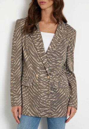Zebra-print blazer in beige and brown with a soft textured fabric, double-breasted buttons, and two front pockets. Tailored fit.