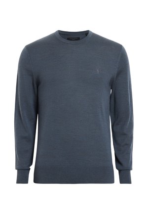 Suéter azul oscuro hecho de un tejido suave, con cuello redondo y mangas largas. Incluye un pequeño logo en el pecho y puños acanalados.