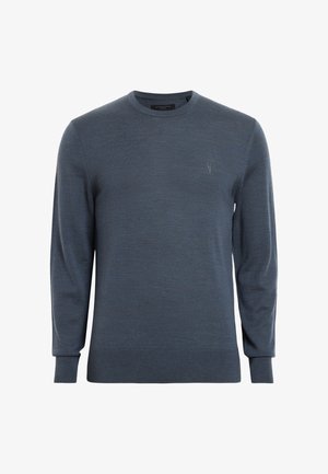 Suéter azul oscuro hecho de un tejido suave, con cuello redondo y mangas largas. Incluye un pequeño logo en el pecho y puños acanalados.