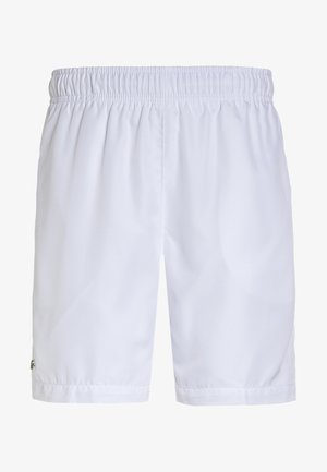 Short de sport blanc à taille élastique avec un design simple et un petit logo près de l'ourlet inférieur sur la jambe gauche.
