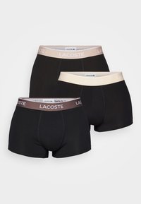 Lacoste vīriešu bokseršortus, trīs iepakojumā. Melna auduma ar elastīgām jostasvietām gaiši bēšā un brūnā krāsā. Gluda tekstūra, klasiskā piegriezne, minimālisma dizains.