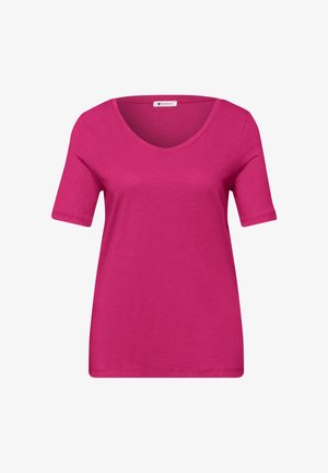 Camiseta de mujer rosa brillante de manga corta con cuello redondo, diseño liso y una etiqueta "Street One" dentro del cuello.