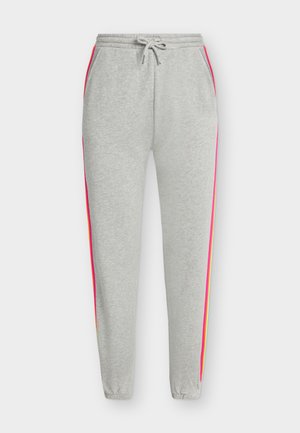 Pantalon de survêtement gris clair avec chevilles élastiques, taille avec cordon, poches latérales et rayures verticales rose vif et orange sur les côtés extérieurs des jambes.