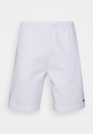 White cotton shorts with an elastic waistband. Features a cropped design and a small logo accent on the lower right leg.