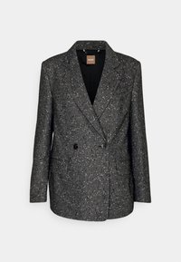 Veste croisée gris foncé à motifs tachetés avec revers à encoche et deux poches avant, fermeture à boutons, et doublure intérieure noire.