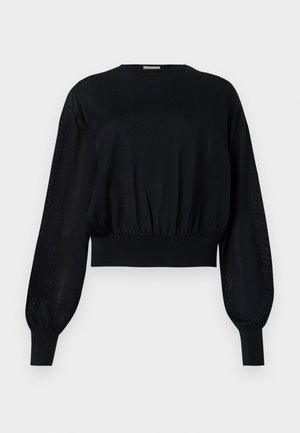 Černý zkrácený top s kulatým výstřihem, nabíranými dlouhými rukávy a žebrovanými manžetami. Disponuje těsným elastickým pasem a průhlednými bočními panely.