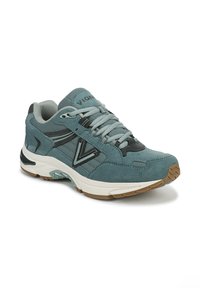 Blue suede sneaker with mesh accents, black stripes, and logo. Round toe, flat rubber sole, cushioned collar, and lace-up front.
