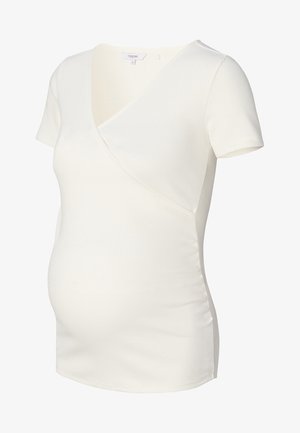 Maternity top met korte mouwen van crèmekleurige ribstof, met een kruislings V-halsontwerp en zijkant ruches voor een aansluitende silhoeet.