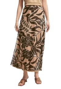 Jupe longue en tissu léger avec un imprimé botanique marron et beige, de coupe fluide et dotée d'une taille élastique.