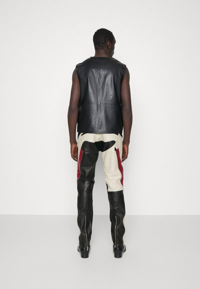 STUDIO ID ANTOINE BIKER TROUSERS - Usnjene hlače - black/red/off white