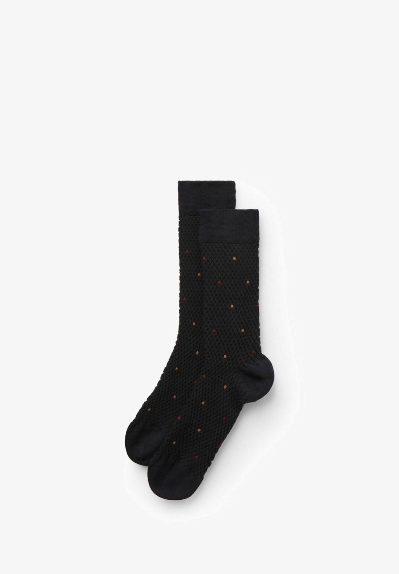 Czarne dziane skarpety z teksturowanym wzorem, zdobione wielokolorowymi kropkami w odcieniach czerwieni i beżu, wykończone solidnym czarnym mankietem.