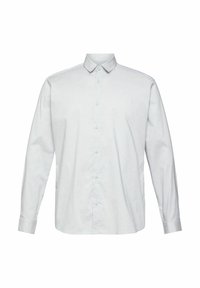 Chemise blanche à manches longues avec col classique et poignets boutonnés, présentée sur un fond blanc uni.