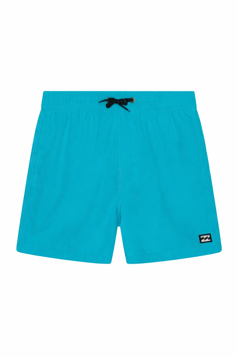 Bright turquoise swim shorts with an elastic waistband, black drawstring, side pockets, and a small black and white logo patch on the leg.