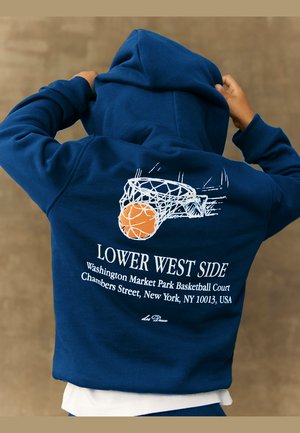 Navy blue hoodie featuring a basketball graphic with a net and an orange ball, and text reading “LOWER WEST SIDE” on the back.