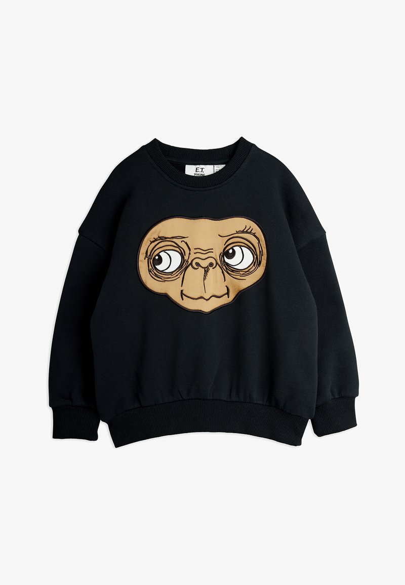 Μαύρη ζακέτα με μεγάλη, καφέ καρτούν μορφή προσώπου με έντονα μάτια και στρογγυλή μορφή. Περιλαμβάνει ραμμένα μανίκια και ταινία στη μέση.