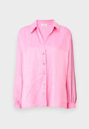 Rosa Langarmhemd aus glattem Stoff. Mit Kragen, Knopfleiste und elastischen Bündchen. Minimalistisches Design.