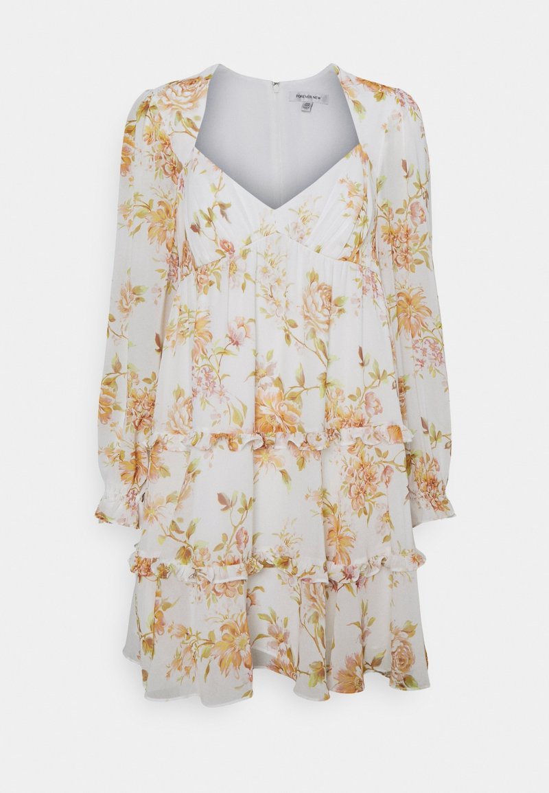 Robe longue blanche à manches longues avec volants superposés, encolure en V, et imprimé floral orange et vert sur un tissu léger.