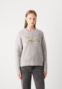 Gray ribbed knit sweater with a round neckline and long sleeves, featuring gold embroidered text "Create" across the front.