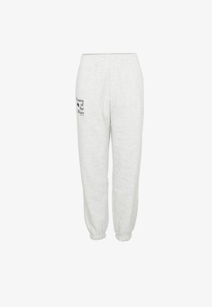 Graue Baumwoll-Jogginghosen mit einem elastischen Bund, schmal zulaufenden Bündchen und schwarzem Text mit der Aufschrift "Women of the Wave" am linken Bein.