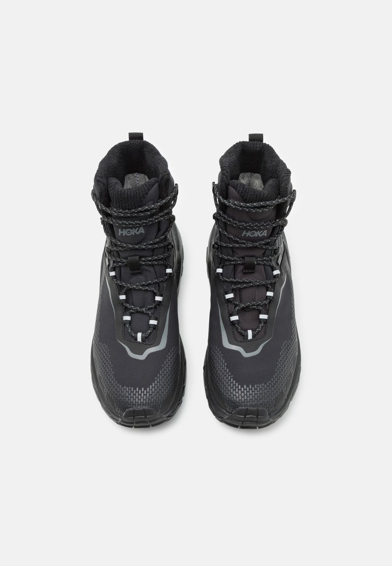 Black hiking boots with a textured upper, reinforced toe, and gray accents. Features include reflective laces and padded collar for support.