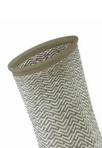 Wäscheständer aus gewebtem Material mit Chevron-Muster in Beige und Weiß, ausgestattet mit einem weichen, flexiblen Rand und einer strukturierten Stoffoberfläche.