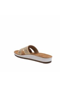 Infradito beige con design ritagliato e accenti a pattern. Morbido plantare imbottito e suola intermedia bianca con suola esterna marrone.