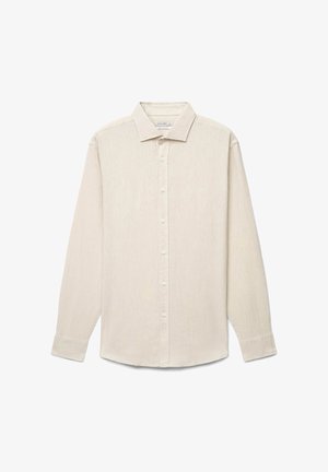 Camicia beige a maniche lunghe con bottoni, colletto e polsini, stesa in piano, vista frontale su sfondo bianco.