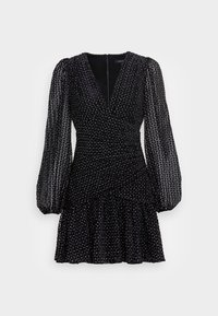 Robe noire avec un tissu texturé à pois, décolleté en V plongeant, manches longues en organza et ourlet à volants évasés. Fermeture zippée au dos.