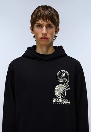 Black hooded sweatshirt featuring three white patches with various logos. Soft fabric texture, standard fit, adjustable hood.
