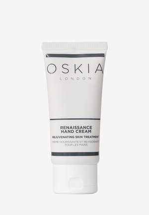 Tube de crème pour les mains OSKIA London Renaissance, étiqueté comme traitement rajeunissant pour la peau et crème nourrissante pour les mains en anglais et en français.