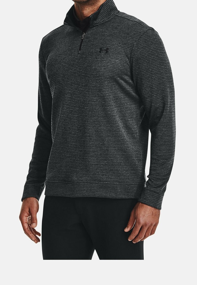 Pullover a maniche lunghe a righe nere con colletto zip e logo sul petto, caratterizzato da una texture liscia e un design aderente.