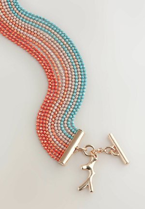 Multi-strand bracelet featuring glass beads in red, pink, and blue hues, with a gold-toned clasp and a decorative charm.