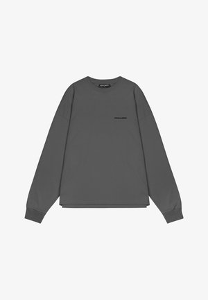 Sivý dlhý rukáv mikina vyrobená z mäkkej bavlny, s okrúhlym výstrihom, vo voľnom strihu a malým logom na prednej ľavej strane.