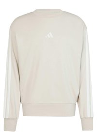 Lys beige sweatshirt med lange ærmer, rund halsudskæring og hvid tre-stribe design langs begge ærmer. Har et lille hvidt logo på brystet.