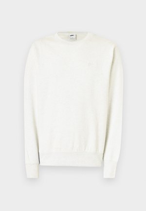 Felpa bianca a maniche lunghe con scollo tondo, polsini e orlo a costine, con un logo Nike discreto sul petto.