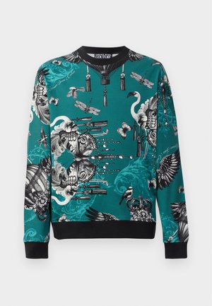 Teal sweatshirt featuring intricate black and white graphic patterns of animals and ornamental designs; ribbed cuffs and neckline.