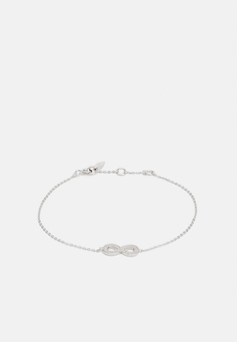 Bracelet délicat en chaîne argentée avec un pendentif symbole de l'infini orné de petites pierres claires, fermé par un fermoir homard.