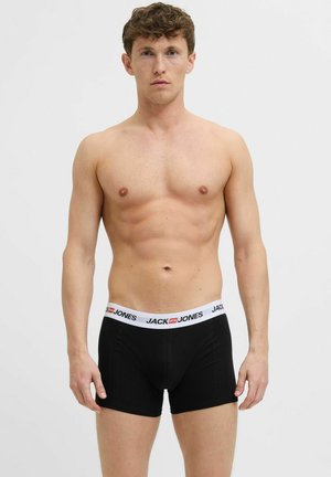 Schwarze Boxershorts aus weichem Stoff mit einem weißen Bund, auf dem "JACK & JONES" in Rot aufgedruckt ist. Klassisches, figurbetontes Design und mittellange Schenkel.
