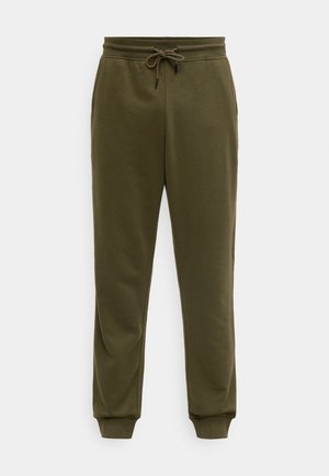 Pantalones deportivos verde oliva con cintura ajustable con cordón, piernas cónicas y puños elásticos. Fabricados con tela suave y lisa con acabado mate.