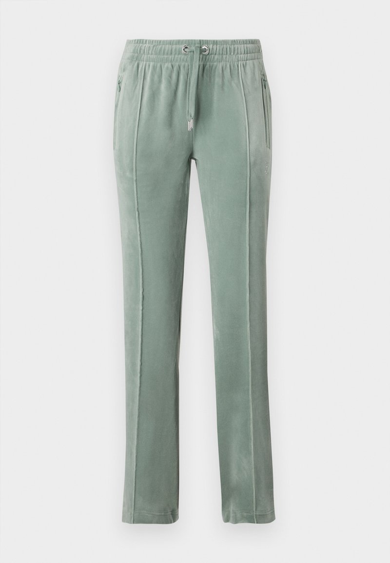 Pantalons de survêtement en velours de couleur verte douce, avec une taille élastique à cordons de serrage, des poches latérales et des détails de couture verticaux contrastants.