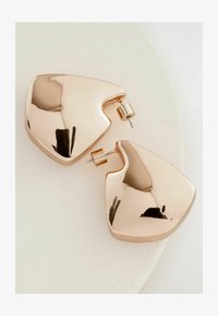 Sélectionné, gold tone