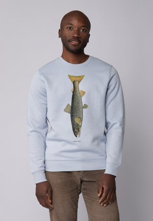 Light blue sweatshirt featuring a detailed graphic of a fish, with yellow accents on the tail and intricate patterns on its body.