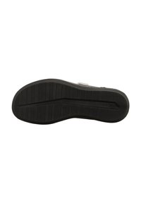 Schwarze Schuhsohle mit horizontalen Rillen und einem glatten Abschnitt. Enthält eine Größenmarkierung "37", die im Material eingeprägt ist.