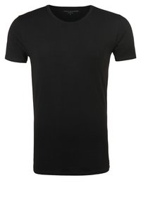 Black cotton T-shirt with short sleeves, crew neck, and a smooth texture. Features a subtle logo printed on the collar area.