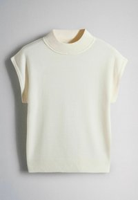 Cream-colored knit sleeveless sweater with a high ribbed collar and ribbed hem on a flat neutral background.
