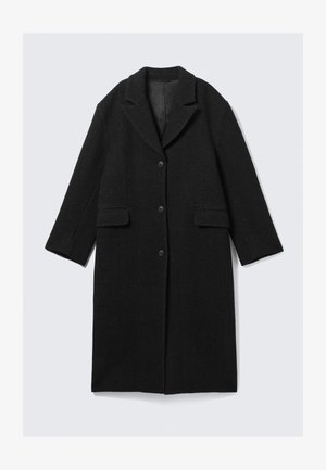 Must must ümberkaudse kraega, kolme nööpiga ja kahe esiseguga, sirge silueti ja veidi lühikeste varrukatega.